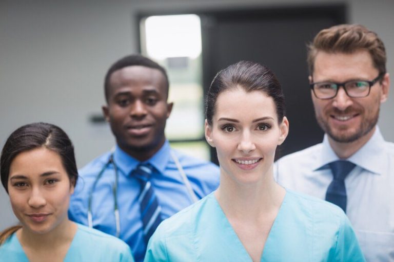 Healthcare professional engaging with a patient in a modern medical environment, representing professionalism and care in healthcare recruit